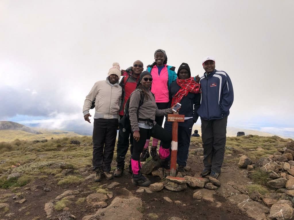 GA Insurance team at the top of Mt Satima 